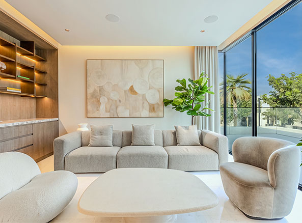 tilal al ghaf lounge with a sofa and armchairs