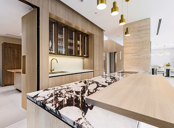 tilal al ghaf marble breakfast bar with wooden cabinetry